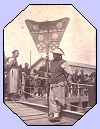 Chinese pall bearer carrying a banner. 