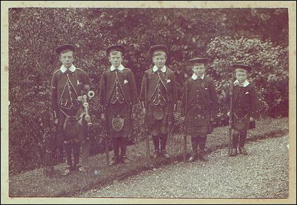 A photograph of the five brothers, all wearing the kilt, and lined up in order of age and height. 