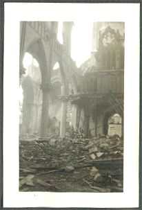 Pillars and some of the arches are all that remain of the church walls; there is no roof.  Everything else is a tangled heap of rubble.