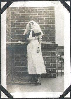 Full length photograph of Jessie Mitchell, an army nurse, in uniform.