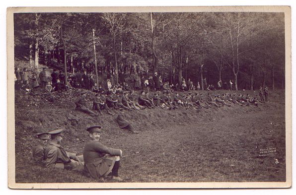 Finding a place to sit on the grass banking.