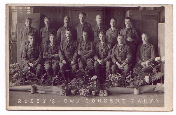 A formal group photograph.  Everyone is in uniform.