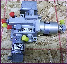 Current operated fuel spill valve