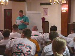 Head Coach Gary Marshall leads the team talk at the hotel, the night before the game.