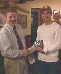 Gary Marshall presents John Hartley with the season MVP award for offense.