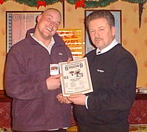 Sean Riley receives his game MVP from Gary Marshall.