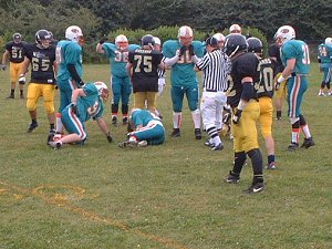 Mark Lindsey (on ground) covers the fumble recovery