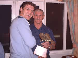 Gary Catherall receives Defensive Player of the Year from 'D' coach Mark Sloan.