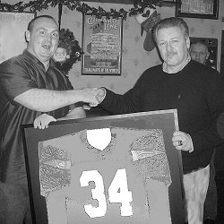 Steve Wooton presented with his shirt by club Chairman Gary Marshall.