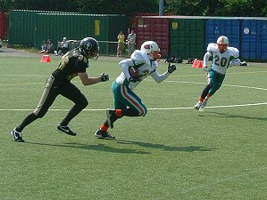 Ross Elliott sets off with the intercepted ball