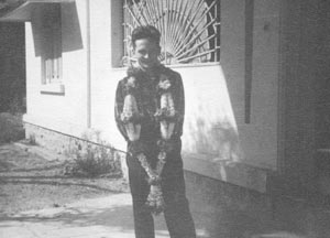 Garlands of white jasmine flowers dangled between my legs