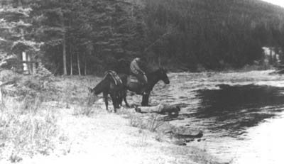 On horseback at the lake